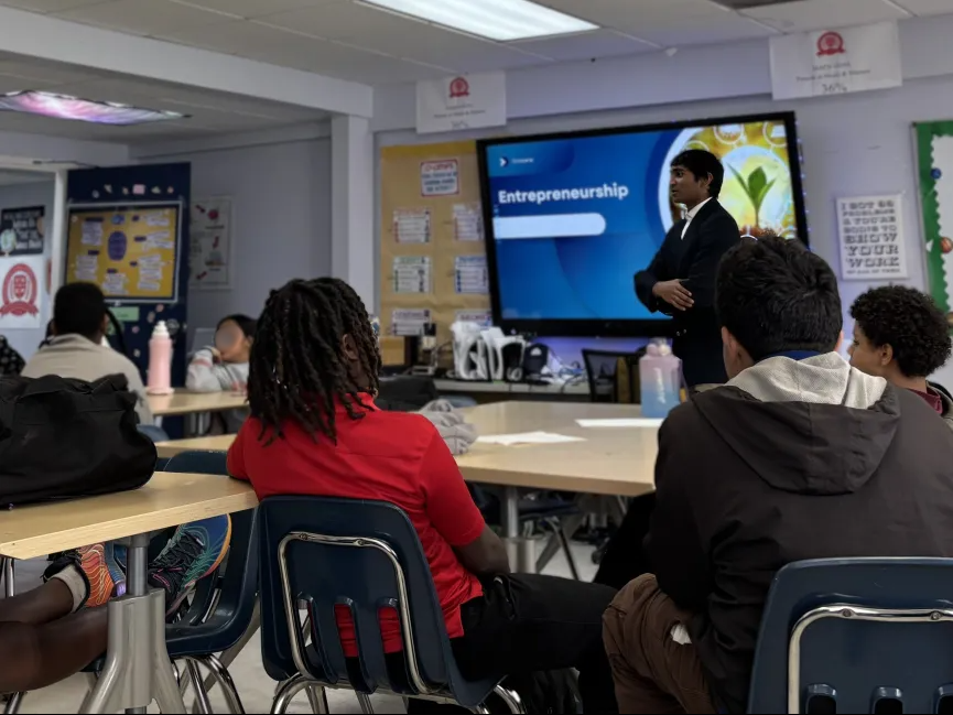 Students viewing problem-solving presentations at Nehemiah Center workshop
