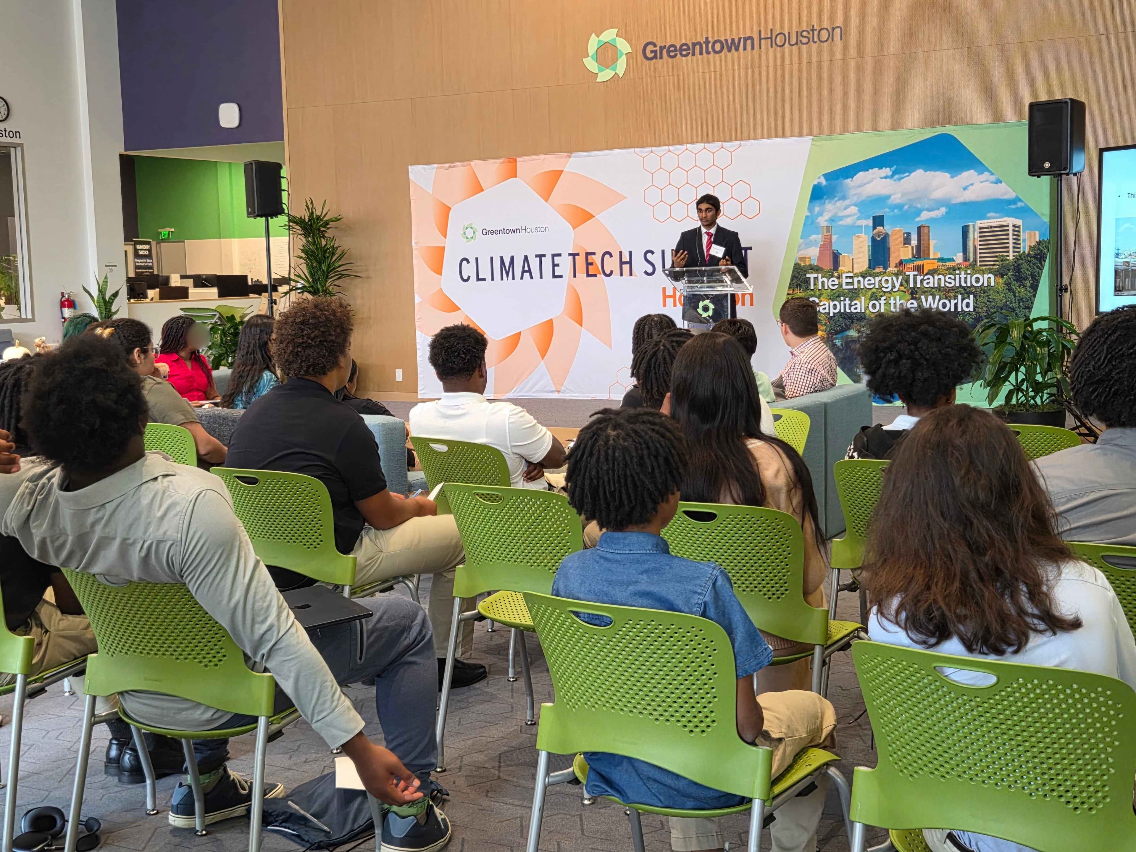Speaker presenting at Greentown Houston ClimateTech Summit to a seated audience